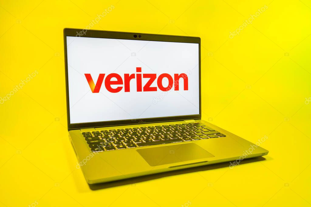 Prague, Czechia - 08 01 2025: A laptop on a uniform background displays the Verizon logo. Verizon is a telecom company providing wireless and broadband services.