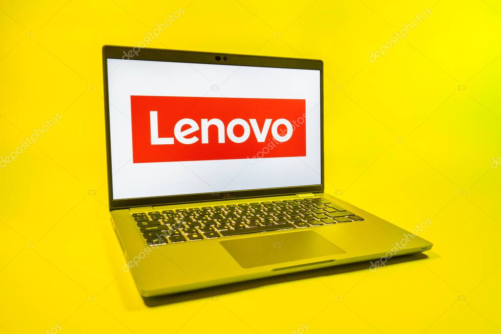 Prague, Czechia - 08 01 2025: A laptop on a uniform background displays the Lenovo logo. Lenovo is a technology company producing computers and electronics.