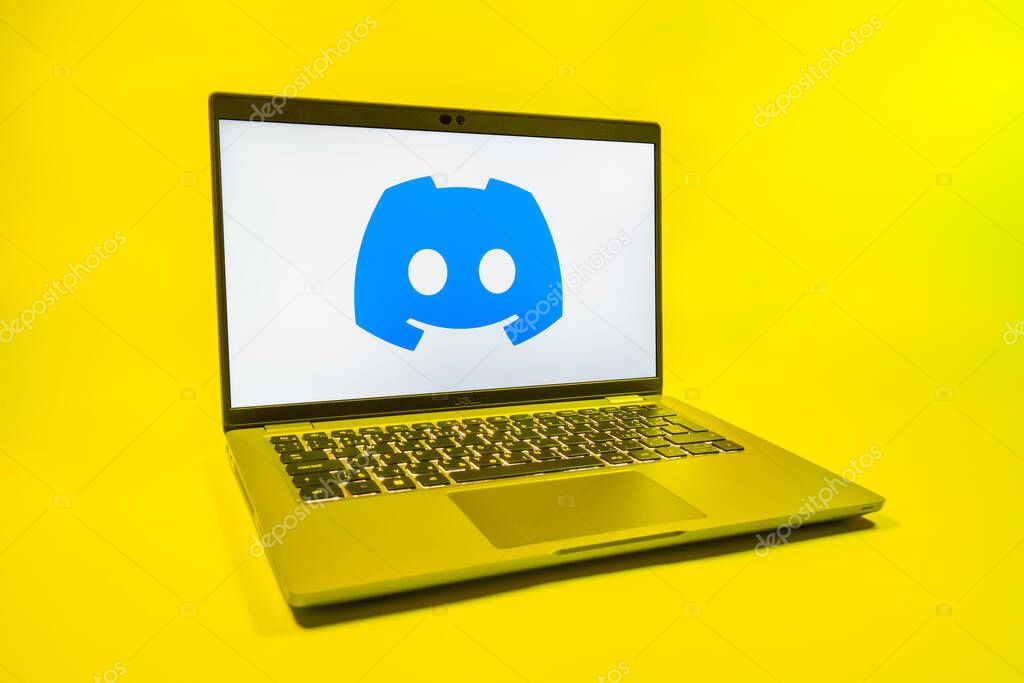 Prague, Czechia - 08 01 2025: A laptop on a uniform background displays the Discord logo. Discord is a platform for voice, video, and text communication.