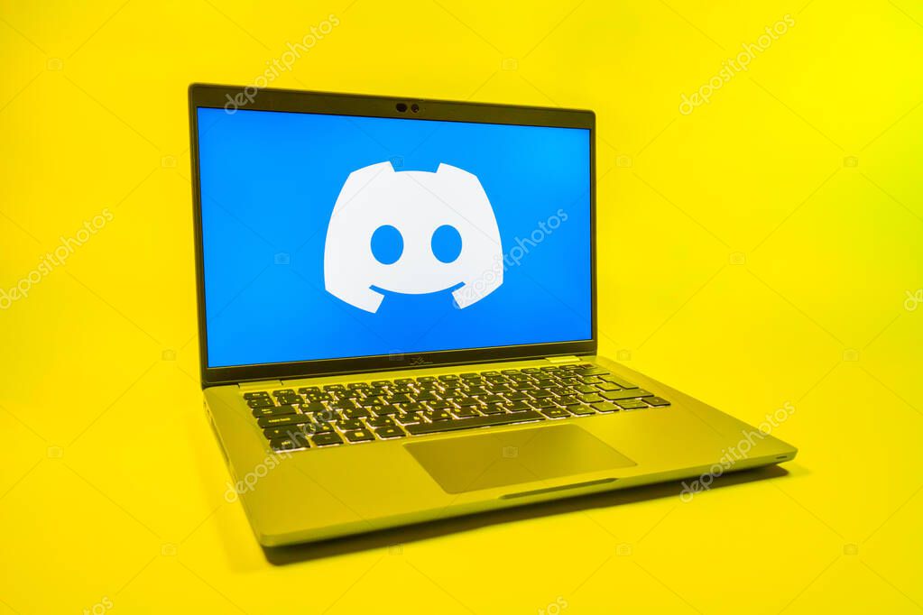 Prague, Czechia - 08 01 2025: A laptop on a uniform background displays the Discord logo. Discord is a platform for voice, video, and text communication.