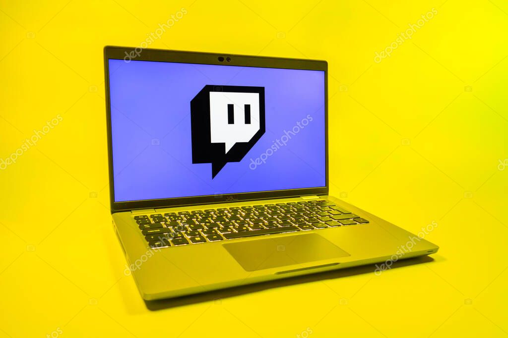 Prague, Czechia - 08 01 2025: A laptop on a uniform background displays the Twitch logo. Twitch is a platform for live streaming games and content.