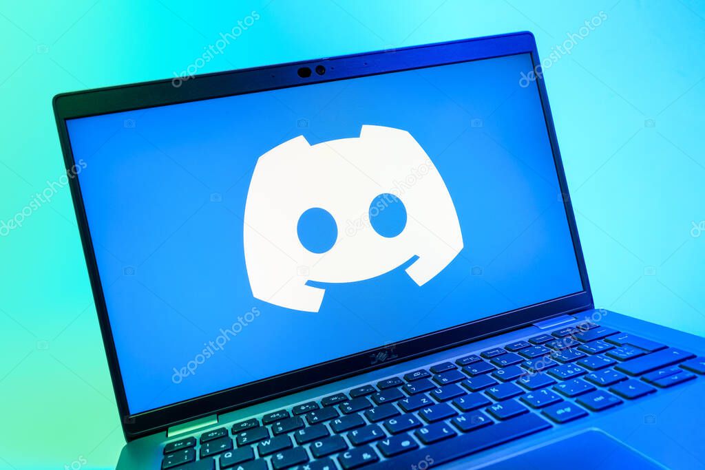 Prague, Czechia - 08 01 2025: A close-up view of a laptop screen displaying the Discord logo. Discord is a platform for voice, video, and text communication.