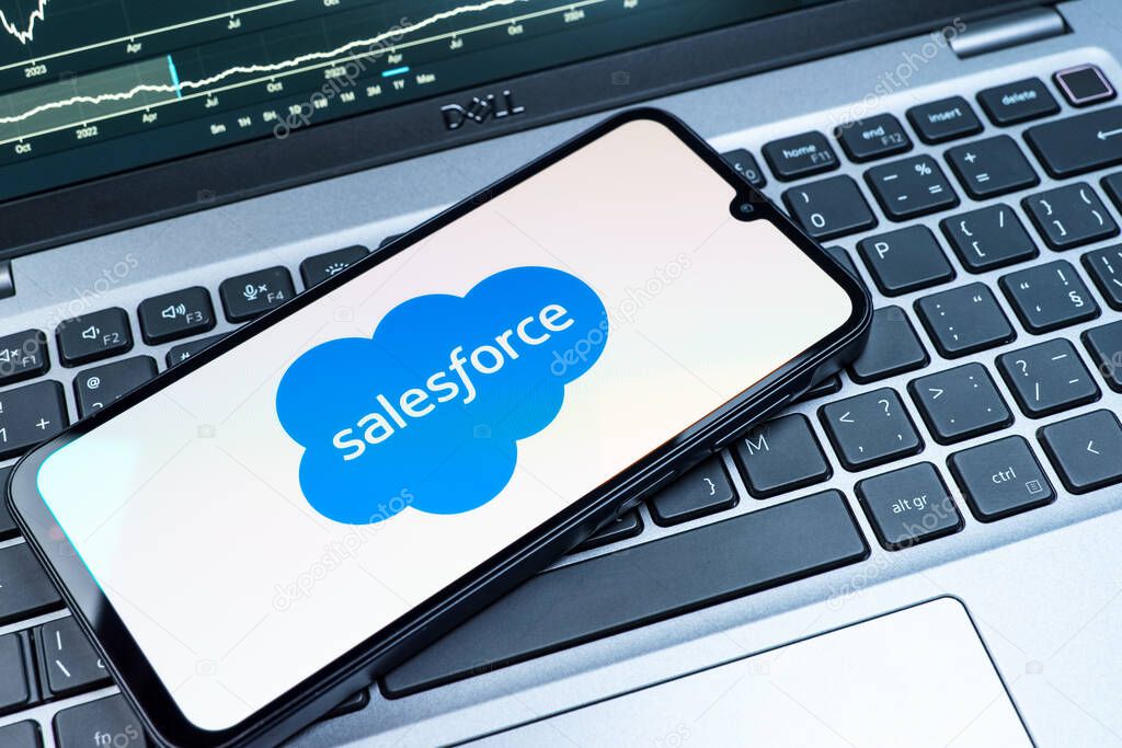 Prague, Czechia - 08 18 2025: A mobile phone on a keyboard displays Salesforce logo. Salesforce is a platform for customer relationship management and cloud services.