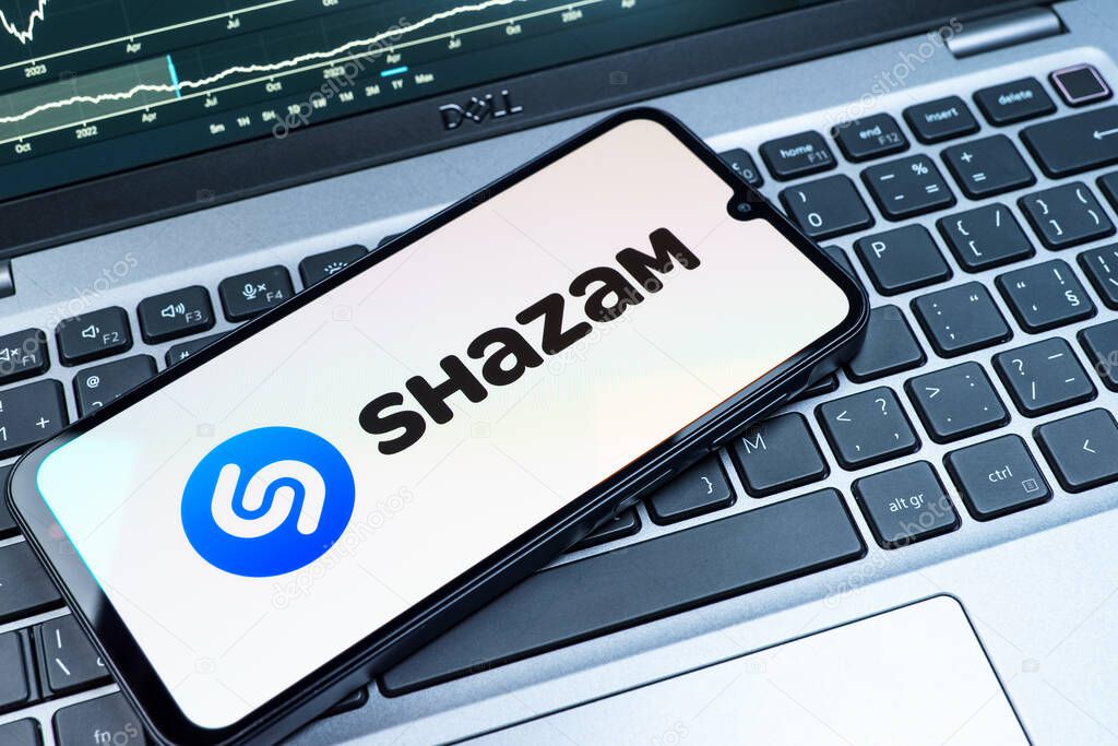 Prague, Czechia - 08 18 2025: A mobile phone on a keyboard displays Shazam logo. Shazam is an app for identifying songs and music tracks.