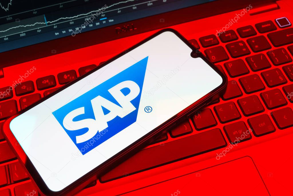 Prague, Czechia - 08 18 2025: A mobile phone on a keyboard displays SAP logo. SAP is a software company providing enterprise applications and solutions.
