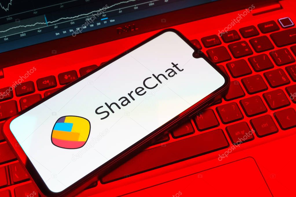 Prague, Czechia - 08 18 2025: A mobile phone on a keyboard displays ShareChat logo. ShareChat is a social platform for sharing content in local languages.