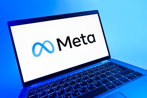 Prague, Czechia - 08 12 2025: A dynamic close-up of a laptop displaying the Meta logo. Meta is a company offering social platforms like Facebook and Instagram.
