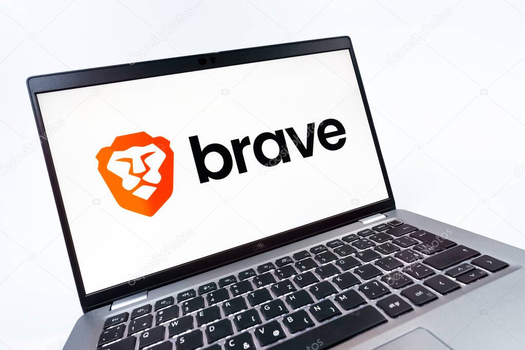 Prague, Czechia - 08 12 2025: A dynamic close-up of a laptop displaying the Brave logo. Brave is a web browser focused on privacy and speed.