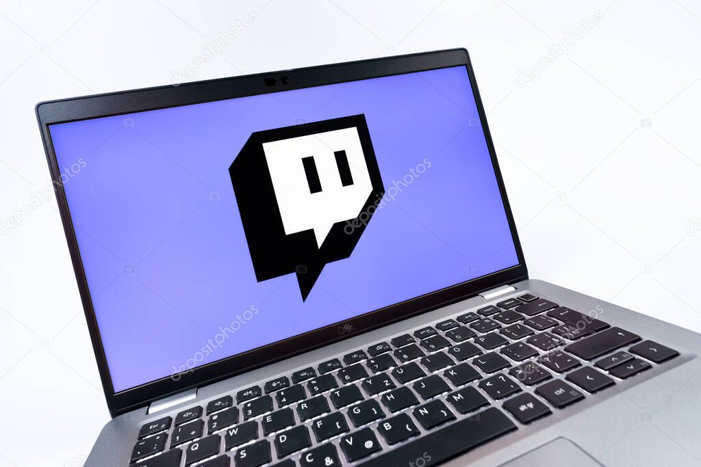 Prague, Czechia - 08 12 2025: A dynamic close-up of a laptop displaying the Twitch logo. Twitch is a platform for live streaming games and content.
