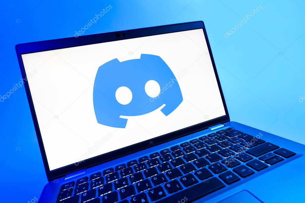 Prague, Czechia - 08 12 2025: A dynamic close-up of a laptop displaying the Discord logo. Discord is a platform for voice, video, and text communication.