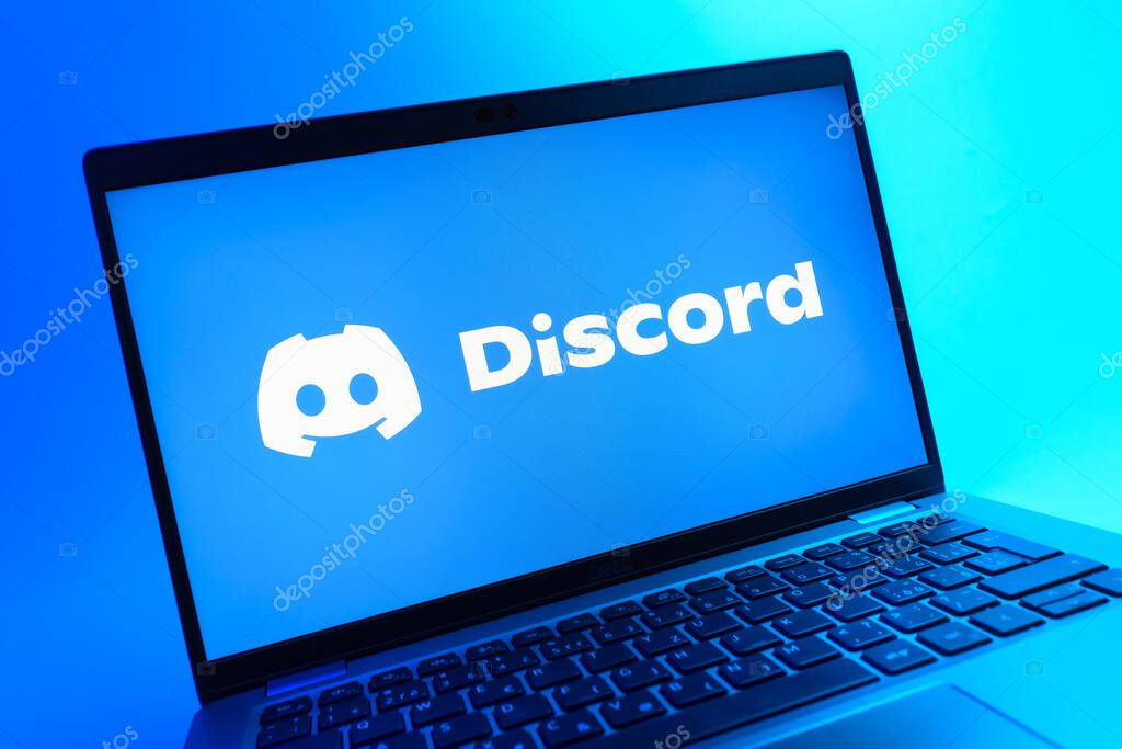 Prague, Czechia - 08 01 2025: A close-up view of a laptop screen displaying the Discord logo. Discord is a platform for voice, video, and text communication.
