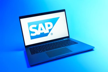Prague, Czechia - 08 12 2025: A dynamic view of a laptop on a uniform background displaying the SAP logo. SAP is a software company providing enterprise applications and solutions.