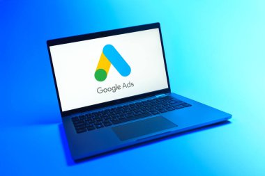 Prague, Czechia - 08 12 2025: A dynamic view of a laptop on a uniform background displaying the Google Ads logo. Google Ads is a platform for creating and managing online advertisements.