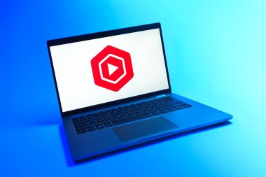 Prague, Czechia - 08 12 2025: A dynamic view of a laptop on a uniform background displaying the Youtube Studio logo. Youtube Studio is a platform for managing and analyzing YouTube channels.