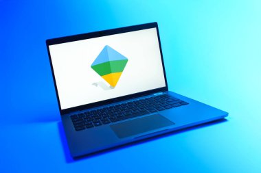 Prague, Czechia - 08 12 2025: A dynamic view of a laptop on a uniform background displaying the Google Family Link logo. Google Family Link is a platform for parental control and child account management.