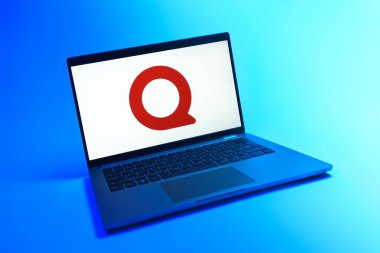 Prague, Czechia - 08 12 2025: A dynamic view of a laptop on a uniform background displaying the Quora logo. Quora is a platform for asking questions and sharing knowledge.