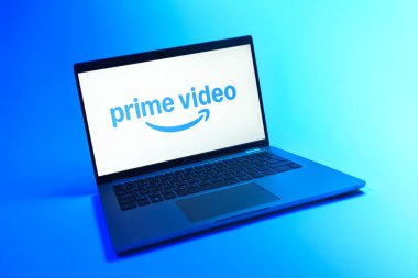 Prague, Czechia - 08 12 2025: A dynamic view of a laptop on a uniform background displaying the Prime video logo. Prime video is a streaming platform for movies and TV shows.