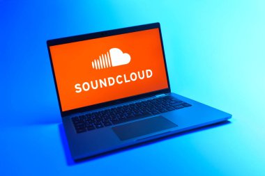 Prague, Czechia - 08 12 2025: A dynamic view of a laptop on a uniform background displaying the SoundCloud logo. SoundCloud is a platform for sharing and streaming music.