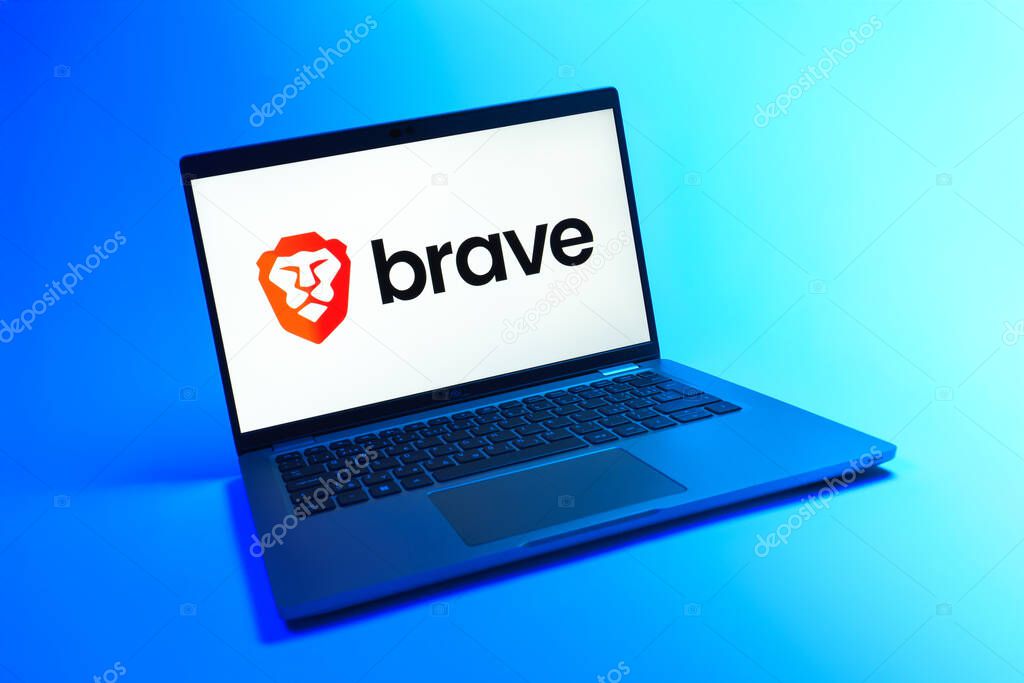 Prague, Czechia - 08 12 2025: A dynamic view of a laptop on a uniform background displaying the Brave logo. Brave is a web browser focused on privacy and speed.