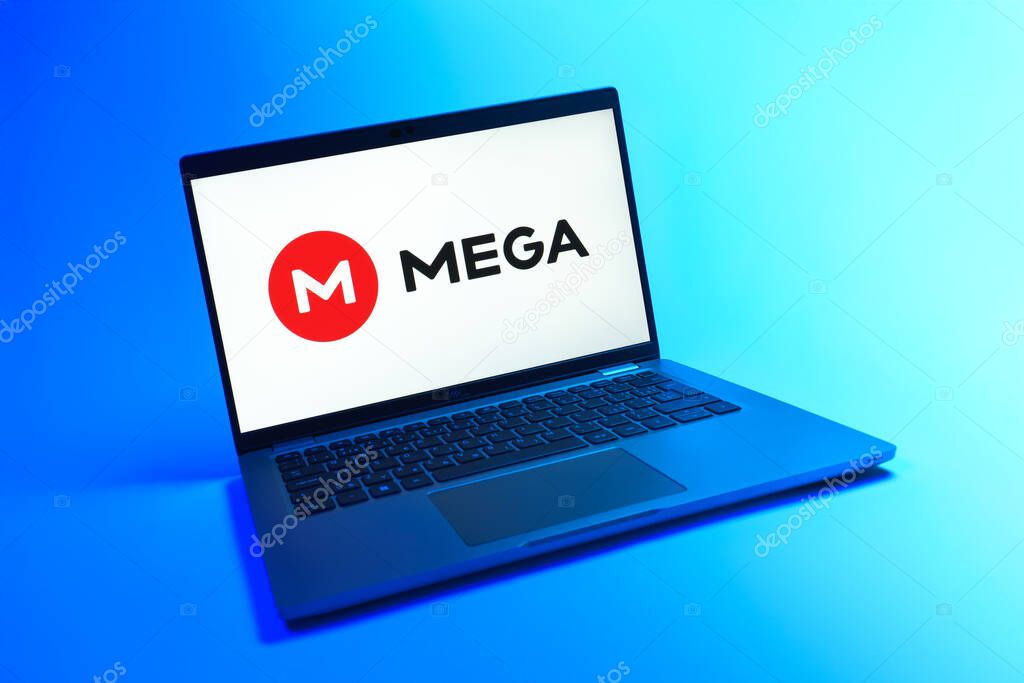 Prague, Czechia - 08 12 2025: A dynamic view of a laptop on a uniform background displaying the Mega logo. Mega is a platform for cloud storage with encrypted file sharing.