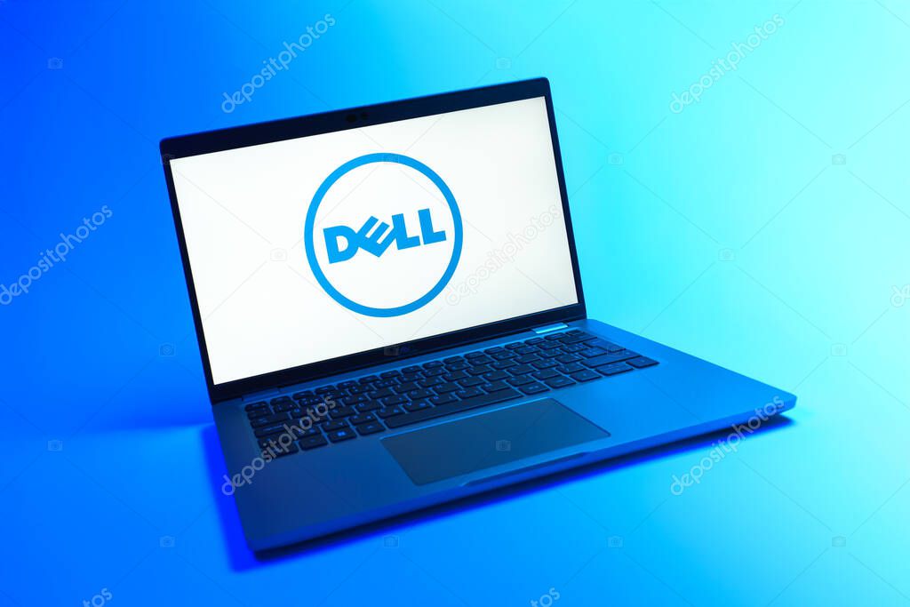Prague, Czechia - 08 12 2025: A dynamic view of a laptop on a uniform background displaying the Dell logo. Dell is a technology company producing computers and IT solutions.