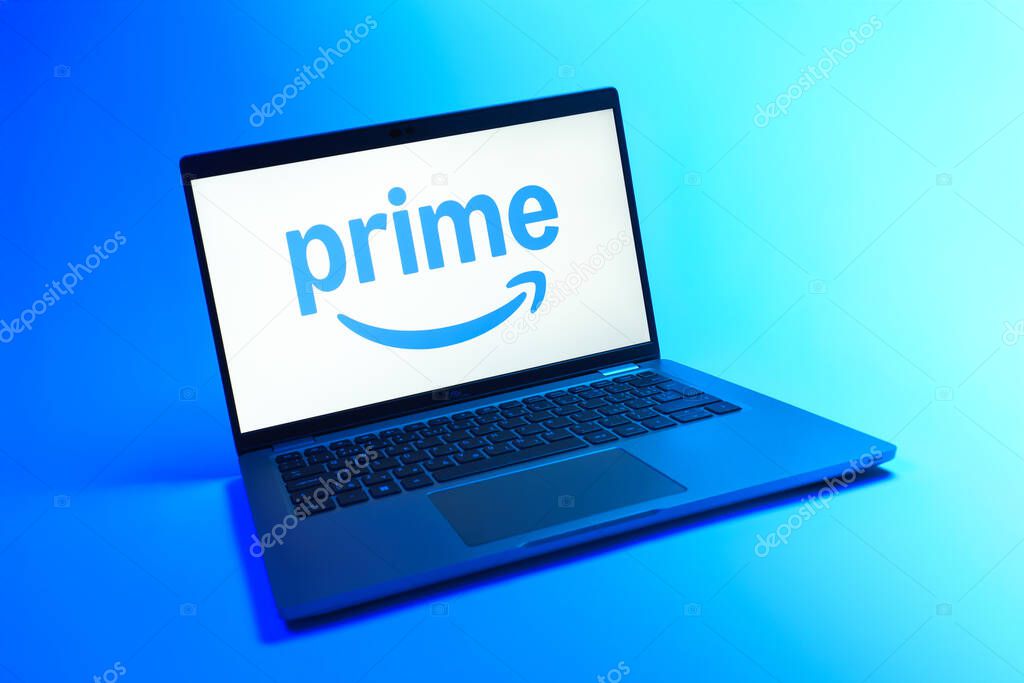 Prague, Czechia - 08 12 2025: A dynamic view of a laptop on a uniform background displaying the Prime logo. Prime is a subscription service for shopping, streaming, and benefits.