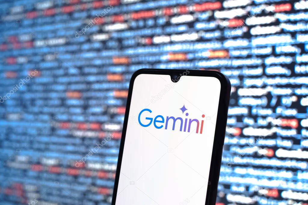 Prague, Czechia - 08 12 2025: Phone in front of a screen showing the Gemini logo. Gemini is a platform for cryptocurrency trading and management.