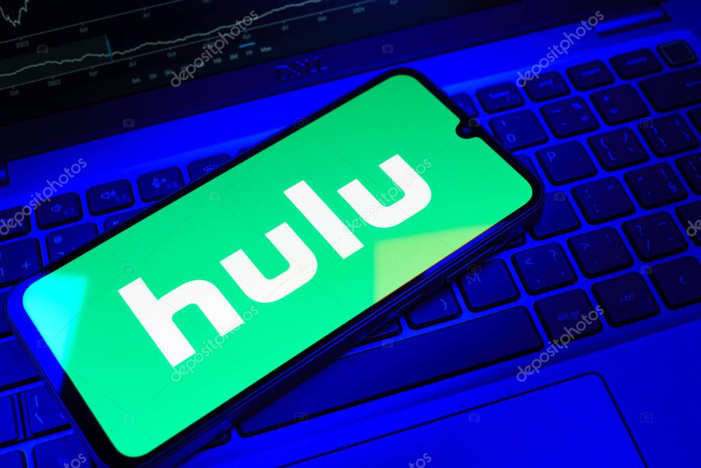 Prague, Czechia - 08 18 2025: A mobile phone on a keyboard displays Hulu logo. Hulu is a streaming platform for TV shows, movies, and live TV.