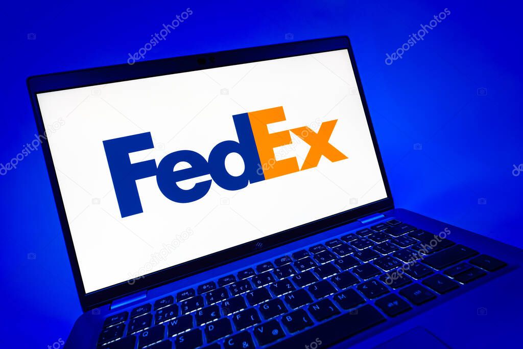 Prague, Czechia - 08 12 2025: A dynamic close-up of a laptop displaying the FedEX logo. FedEX is a logistics company providing shipping and courier services.