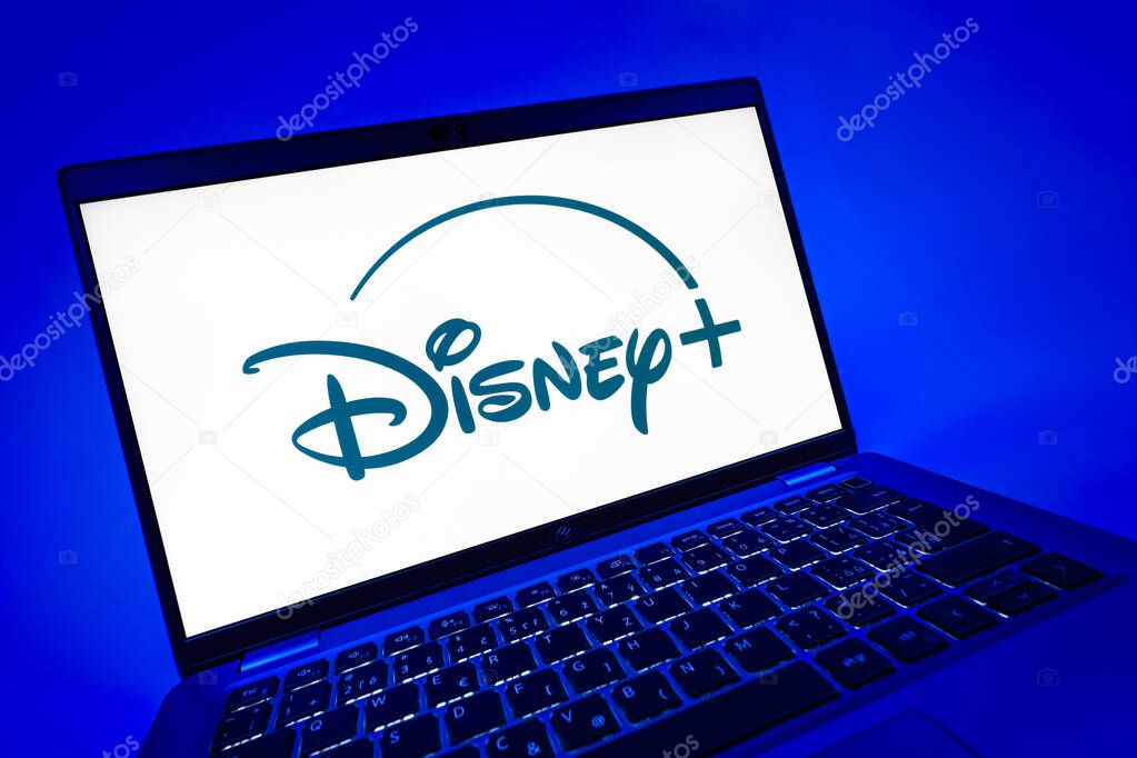 Prague, Czechia - 08 12 2025: A dynamic close-up of a laptop displaying the Disney+ logo. Disney + is a streaming platform for movies and TV shows.