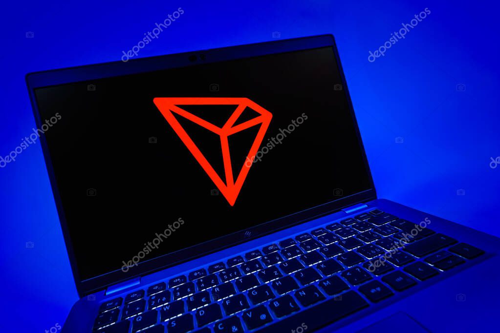 Prague, Czechia - 08 12 2025: A dynamic close-up of a laptop displaying the Tron logo. Tron is a blockchain platform for decentralized applications.