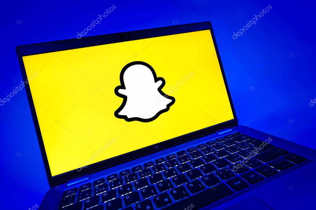 Prague, Czechia - 08 12 2025: A dynamic close-up of a laptop displaying the Snapchat logo. Snapchat is an app for sending photos, videos, and temporary messages.
