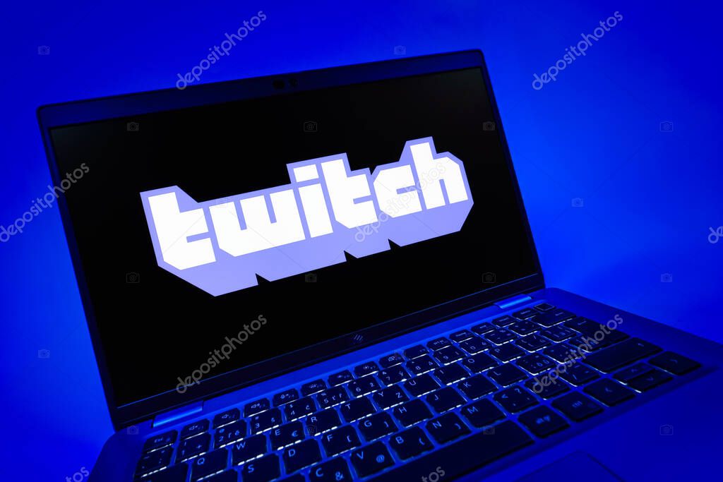 Prague, Czechia - 08 12 2025: A dynamic close-up of a laptop displaying the Twitch logo. Twitch is a platform for live streaming games and content.