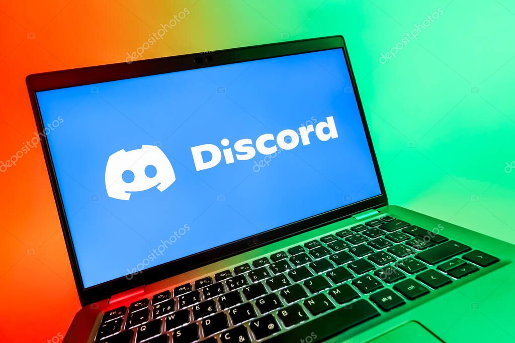 Prague, Czechia - 08 12 2025: A dynamic close-up of a laptop displaying the Discord logo. Discord is a platform for voice, video, and text communication.