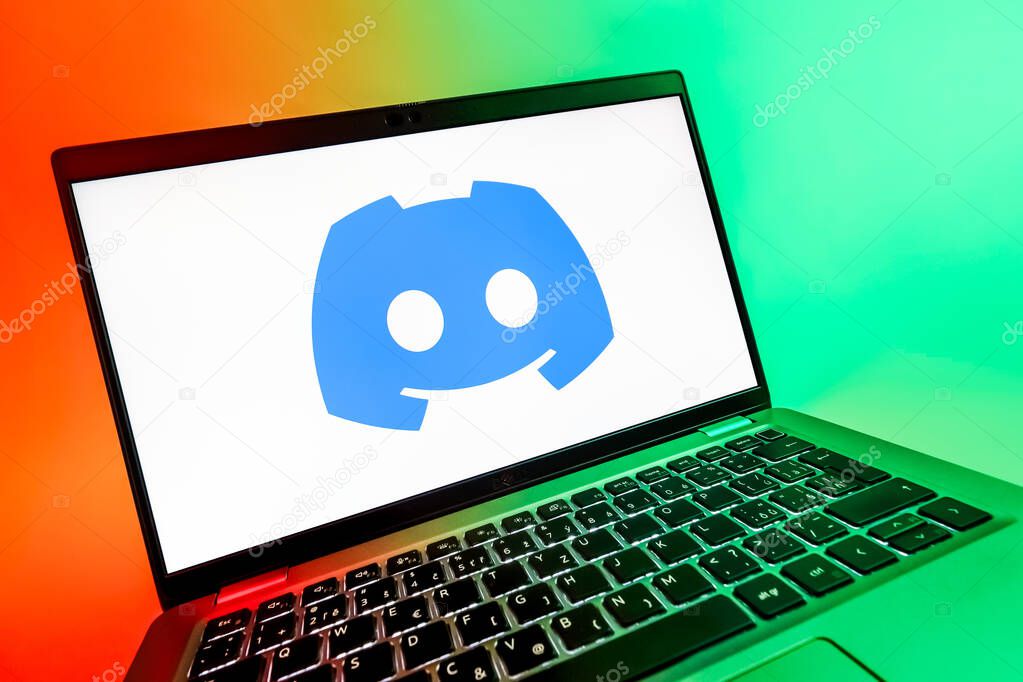 Prague, Czechia - 08 12 2025: A dynamic close-up of a laptop displaying the Discord logo. Discord is a platform for voice, video, and text communication.