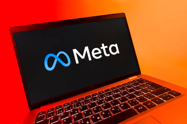 Prague, Czechia - 08 12 2025: A dynamic close-up of a laptop displaying the Meta logo. Meta is a company offering social platforms like Facebook and Instagram.