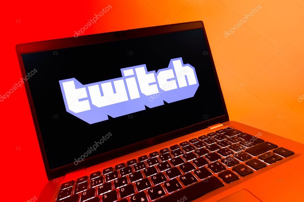 Prague, Czechia - 08 12 2025: A dynamic close-up of a laptop displaying the Twitch logo. Twitch is a platform for live streaming games and content.