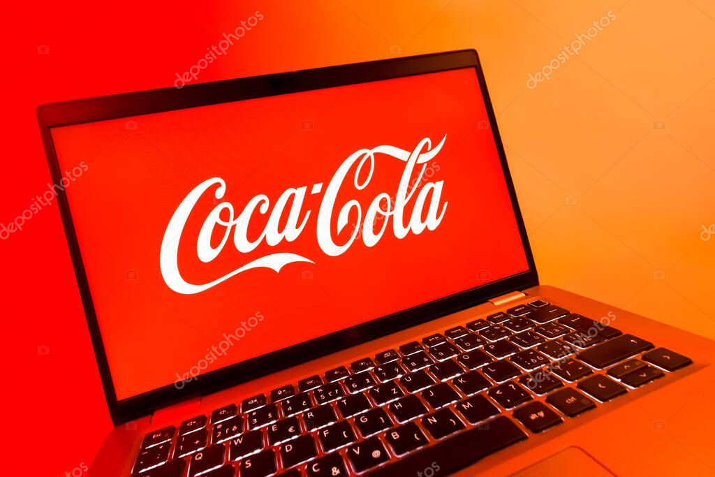 Prague, Czechia - 08 12 2025: A dynamic close-up of a laptop displaying the Coca-Cola logo. Coca-Cola is a beverage company known for its soft drinks.