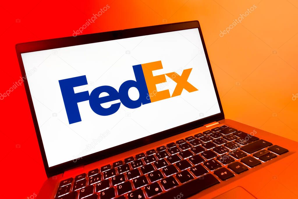 Prague, Czechia - 08 12 2025: A dynamic close-up of a laptop displaying the FedEX logo. FedEX is a logistics company providing shipping and courier services.