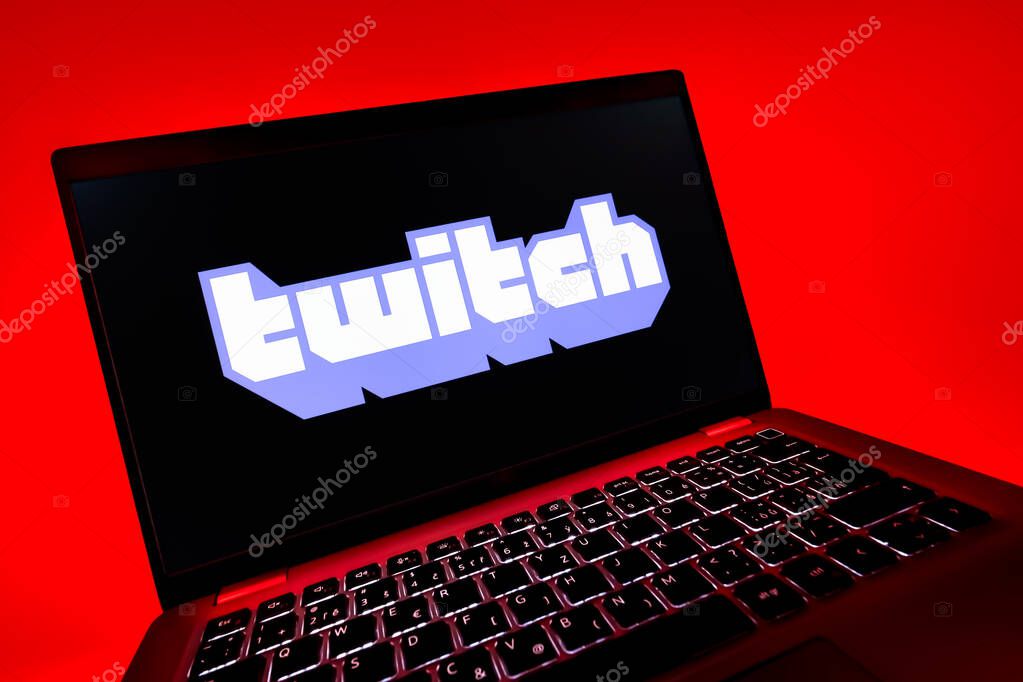 Prague, Czechia - 08 12 2025: A dynamic close-up of a laptop displaying the Twitch logo. Twitch is a platform for live streaming games and content.