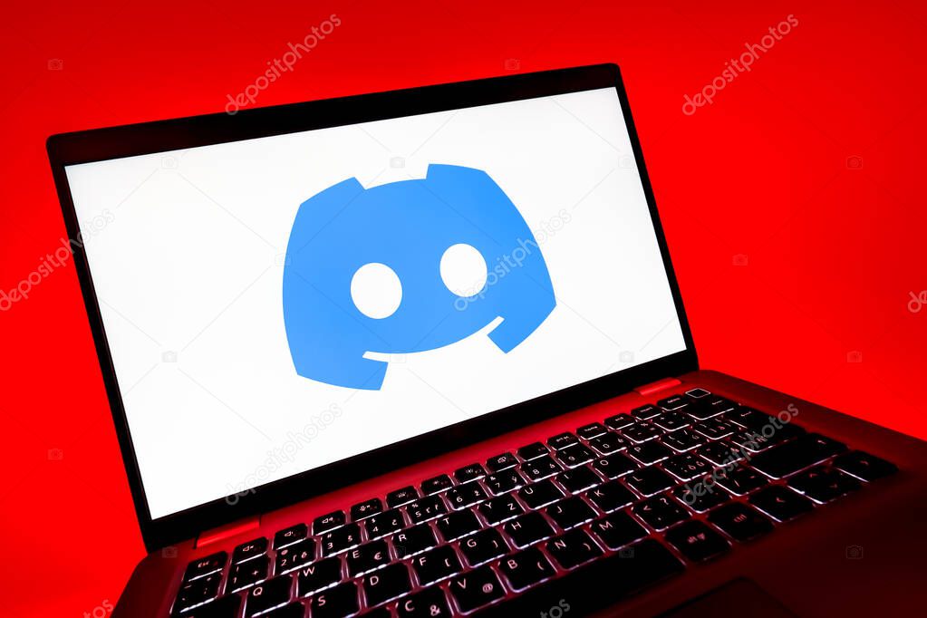 Prague, Czechia - 08 12 2025: A dynamic close-up of a laptop displaying the Discord logo. Discord is a platform for voice, video, and text communication.
