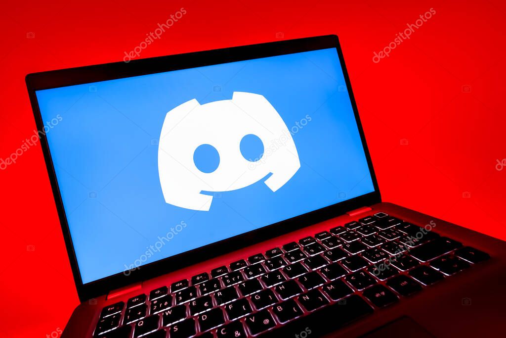 Prague, Czechia - 08 12 2025: A dynamic close-up of a laptop displaying the Discord logo. Discord is a platform for voice, video, and text communication.