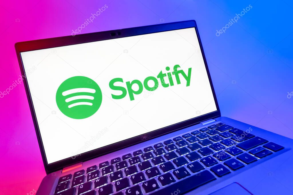 Prague, Czechia - 08 12 2025: A dynamic close-up of a laptop displaying the Spotify logo. Spotify is a platform for streaming and discovering music.
