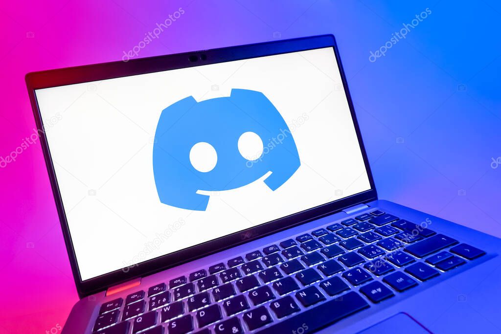 Prague, Czechia - 08 12 2025: A dynamic close-up of a laptop displaying the Discord logo. Discord is a platform for voice, video, and text communication.