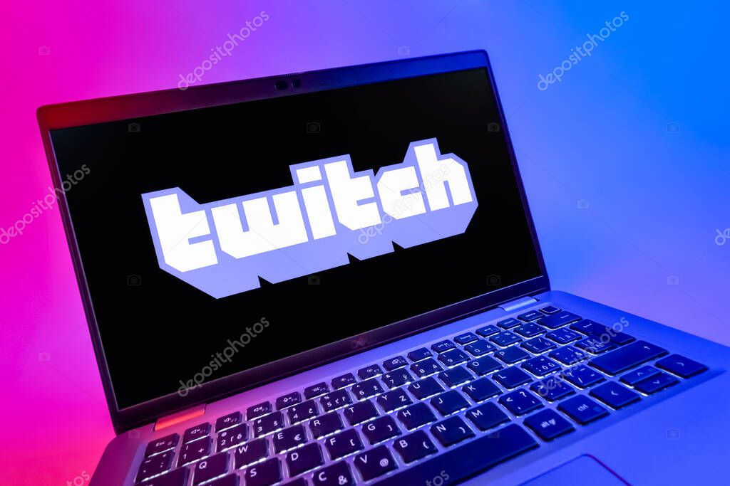 Prague, Czechia - 08 12 2025: A dynamic close-up of a laptop displaying the Twitch logo. Twitch is a platform for live streaming games and content.