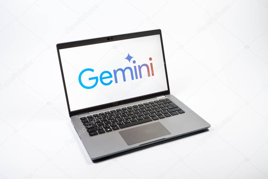 Prague, Czechia - 08 12 2025: A top-down view of a laptop on a uniform background displaying the Gemini logo. Gemini is a platform for cryptocurrency trading and management.