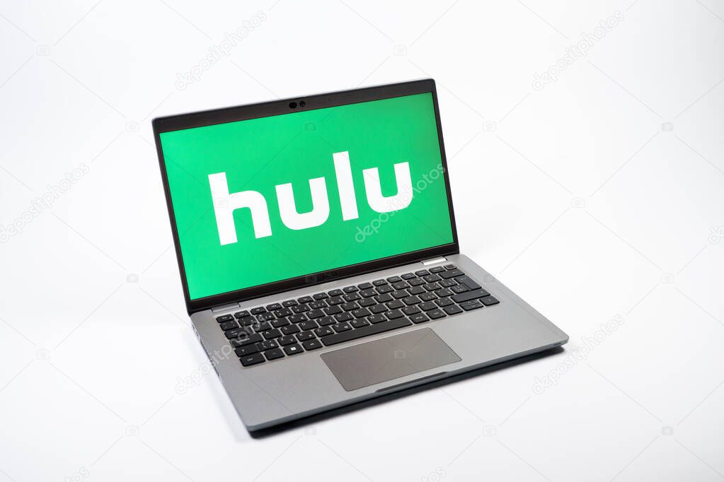 Prague, Czechia - 08 12 2025: A top-down view of a laptop on a uniform background displaying the Hulu logo. Hulu is a streaming platform for TV shows, movies, and live TV.