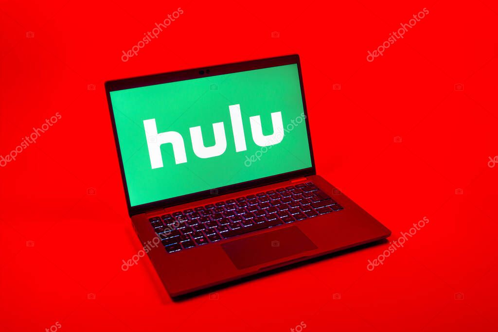 Prague, Czechia - 08 12 2025: A top-down view of a laptop on a uniform background displaying the Hulu logo. Hulu is a streaming platform for TV shows, movies, and live TV.