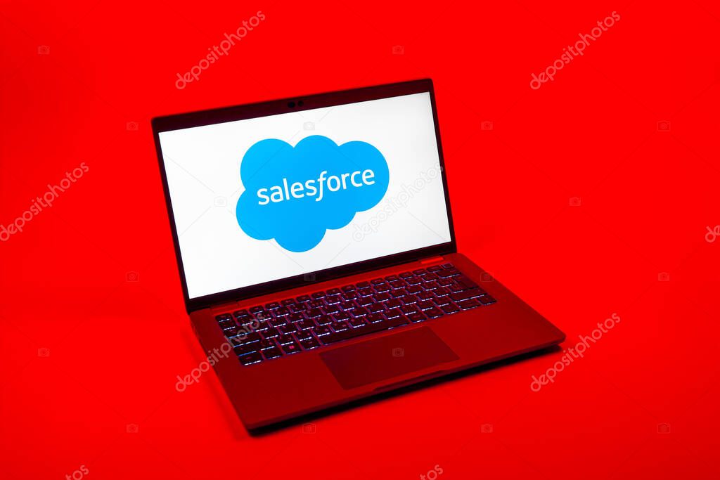 Prague, Czechia - 08 12 2025: A top-down view of a laptop on a uniform background displaying the Salesforce logo. Salesforce is a platform for customer relationship management and cloud services.