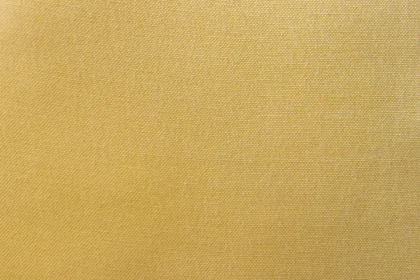 Görünür dokuma desenli sarı kumaş dokusu ve yüzeyinde küçük kusurlar var. Yüksek kalite fotoğraf
